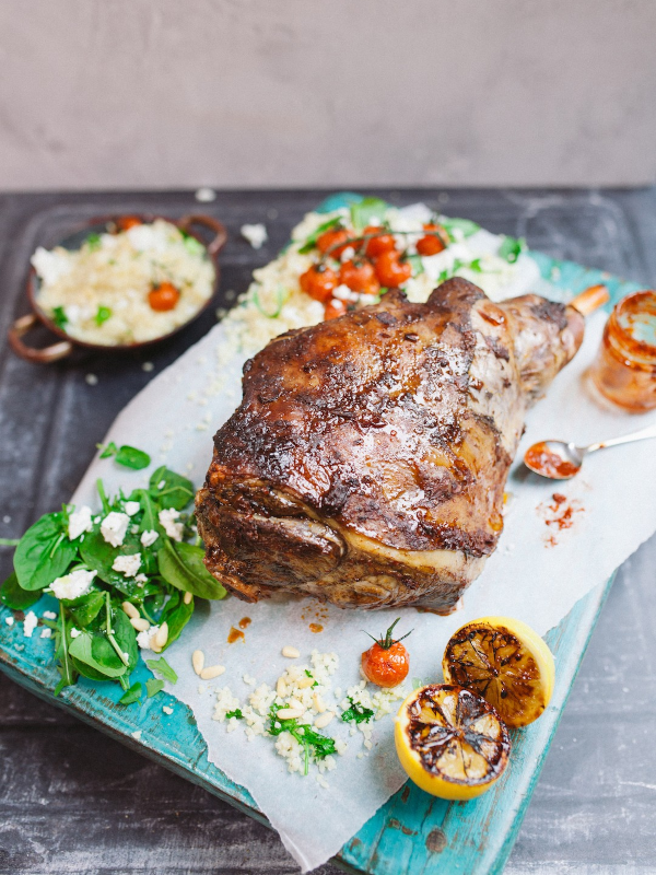 Harissa marinated leg of lamb with roasted tomato & bulgur wheat salad